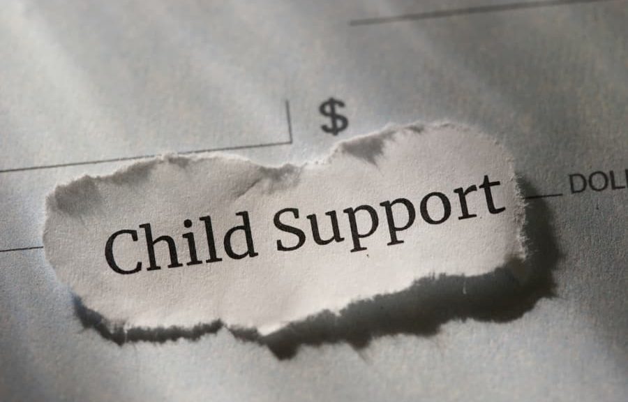 Ripped piece of paper with the words “child support” printed on it